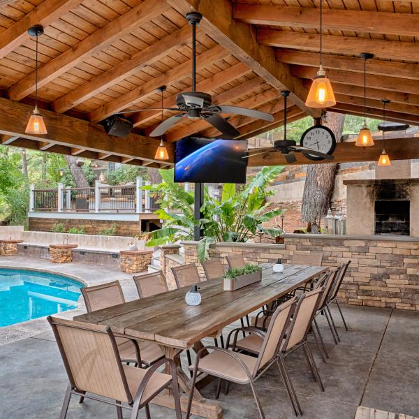 outside tv and audio system by a pool